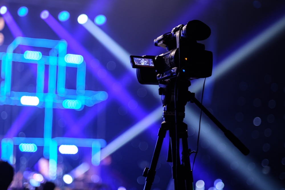 Tv,Camera,In,A,Concert,Hall,With,Laser,Lighting.,Professional