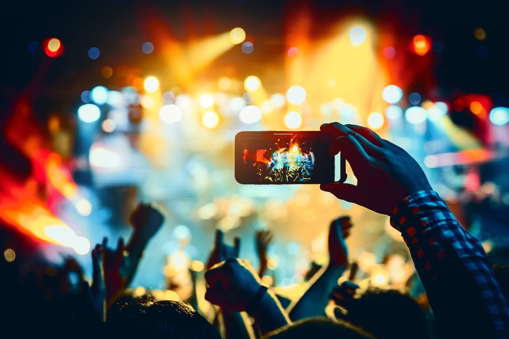 Man,Takes,A,Picture,Of,The,Show,At,The,Concert